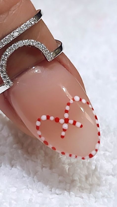 40K views · 1.6K reactions | So happy you Cane into my life. 🤍❤️ - - - -Easy to do Candy Cane style…🤍❤️ -Tools: Double sided dotter or Toothpick - - - - - - - #perthnailtech #nails #christmasnails #trending #viral #reels #featured #instagood #candycanenails #foryou #xmasnails #beauty #christmasnailsart #christmasnailsart #xmasnails #nailtutorial #inspo #beautiful #nailtutorialvideo #unhas #nailitdaily #revolvebeauty #christmas #getnailed #christmasdesign #kiaraskynails #nailswag #nailsmagazine #explore #explorepage | Ty Nguyen | Ariana Grande · Santa Tell Me | Lovely Nails and Beauty Candy Cane Heart Nails, Candy Cane Nail Art, Nail Maintenance, Santa Tell Me, Lily Nails, Candy Cane Nails, Super Cute Nails, Lovely Nails, Christmas Gel Nails