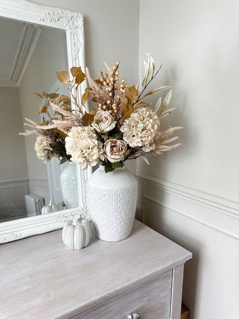 Embrace the season with a touch of faux florals! Link in bio #Autumnwreathforsale #Autumnwreath #Autumnvibes #falldecor #autumnwreath #fyp #autumnhomedecor #farmhousedesign Beige Vase With Flowers, Elegant Flower Arrangements, Autumn Florals, Eucalyptus Stems, Fall Flower Arrangements, Artificial Flower Arrangements, Fall Home, Faux Florals, Autumn Wreaths