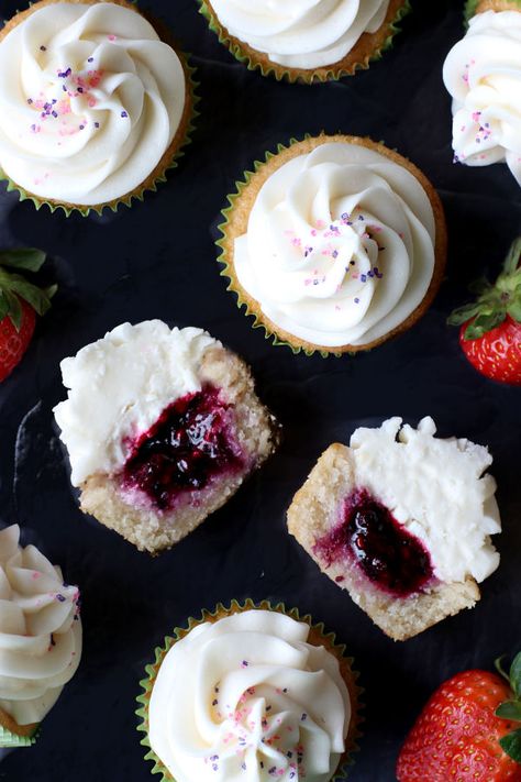 Berry Filled Vanilla Cupcakes Berry Cupcakes Recipes, Vanilla Berry Cupcakes, Chocolate Berry Cupcakes, Cupcakes With Fruit Filling, Berry Filled Cupcakes, Mixed Berry Cupcakes, Vanilla Raspberry Cupcakes, Vanilla Cupcakes With Filling, Huckleberry Cupcakes