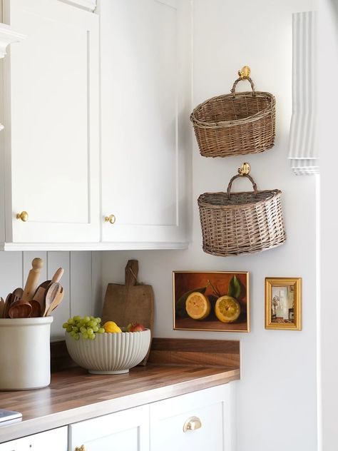 This White Galley Kitchen Went from Builder-Grade to Cottage-Cool Eclectic White Kitchen, Cottage Style Galley Kitchen, Ikea Cottage Kitchen, Butcher Block Galley Kitchen, Cottage Open Shelving Kitchen, Galley Kitchen White, Galley Kitchen Apartment, Floating Shelves Cottage Kitchen, Cottagecore Galley Kitchen