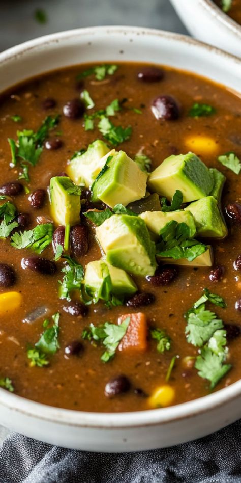 Warm up with a spicy Black Bean Soup! With jalapeño and cayenne, this soup delivers a flavorful kick perfect for chili lovers. Panera Black Bean Soup Recipe, Panera Black Bean Soup, Chicken Black Bean Soup, Spicy Black Bean Soup, Chicken Black Bean, Black Bean Soup Recipe, Dried Black Beans, Bean Soup Recipe, Onion Vegetable