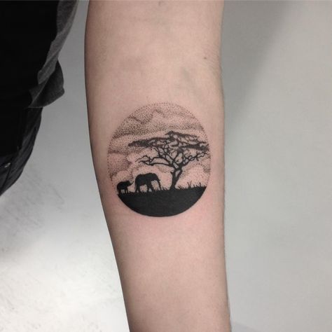 Circular African landscape tattoo on the left forearm African Minimalist Tattoo, Africa Landscape Tattoo, Africa Safari Tattoo, African Animal Tattoos For Women, African Safari Tattoo Ideas, Africa Theme Tattoo, South Africa Tattoos For Women, African Landscape Tattoo, African Forearm Tattoo