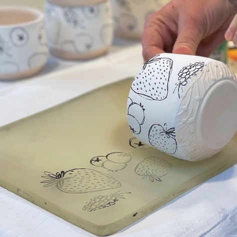 A Slick Way to Transfer Printed Designs onto Curved Surfaces Printing On Pottery, Ceramic Stencil Ideas, Clay Surface Design, Raku Glaze Ideas, Slip Transfer Pottery, Marbled Clay Pottery, Pottery Surface Design, Pottery Painting Techniques, Ceramic Glazing Techniques