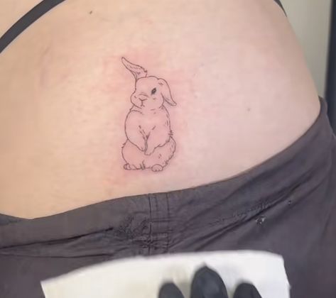 Bunny Hip Tattoo, Bunny Eating Strawberry Tattoo, Dainty Rabbit Tattoo, Bunny Rabbit Tattoo Small, Bunny Holding Flower Tattoo, Red Bunny Tattoo, Realistic Bunny Tattoo, Bunny Angel Tattoo, Stuffed Rabbit Tattoo