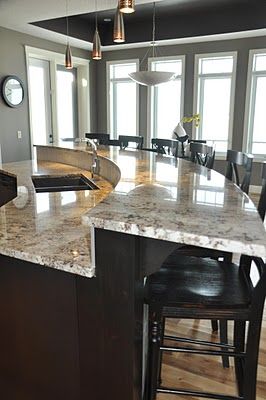 curved bar: but swap the sink for the stove :) Kitchen Island Gas Stove, Diamond Island Kitchen, Kitchen Bar Island Ideas, Curved Kitchen Island With Sink, Two Level Island With Seating, Kitchen Island With Stove And Sink, 2 Level Kitchen Island, Curved Island Kitchen, Two Level Kitchen Island