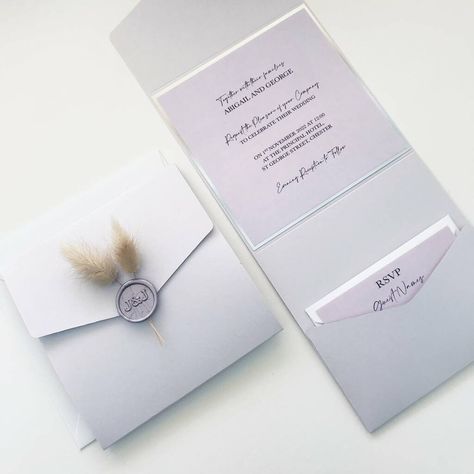 Personalised Wedding invitations with beautiful lilac matte pocketfolds, wax seals and bunny tails! The elegant design is paired with white shimmer envelope. Format: Pocket Fold, Shape: Square, Colour: Lilac pocket and white shimmer envelope Items included: Lilac Pocket, Silver Mirror Backer, Lilac Insert Cards, Lilac Initials Wax Seal, Bunny Tails, White Shimmer Main Envelope, Lilac RSVP and White RSVP Envelope Choosing 'Say It With Print' will mean your invitation pockets and envelopes will ar Wedding Invitations Lilac, Lilac Wedding Invitations, Envelope Format, Pocket Fold Wedding Invitations, Navy Wedding Invitations, Lilac Wedding, Wedding Invitation Inspiration, Bunny Tails, June Wedding