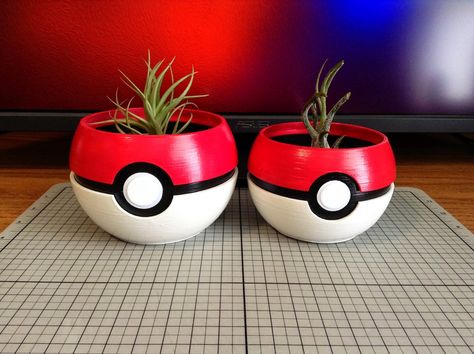 29.99 CAD Enhance your home decor with this unique Pokemon Pokeball Planter🌱. Made from high-quality, durable material, this 3D printed planter is not only a functional plant holder but also a novelty piece that celebrates your love for Pokemon. This planter features a lifelike design that mimics the iconic Pokeball, adding a touch of charm and whimsy to any room. Whether you're a long-time Pokemon fan or looking for a fun gift for a loved one, this planter is sure to delight. It's perfect… Pokemon Home Decor, Pokemon Planter, Pokemon Decor, Ceramica Ideas, Planter Decor, Plant Pot Diy, 3d Printing Art, Clay Flower Pots, Frame House