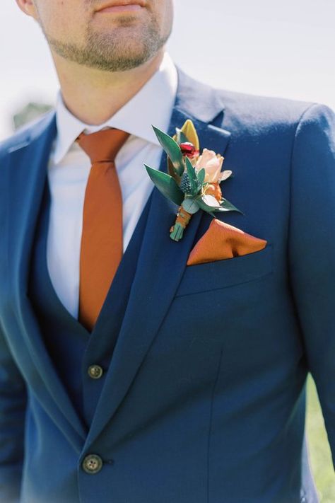 Blues And Orange Wedding, Navy Blue Suit Orange Tie, Blue Color Suits For Men, November Wedding Groom Attire, Navy Blue Suit Rust Tie, Navy Blue And Burnt Orange Wedding Suit, Blue Suit With Orange Tie, Blue Suit Terracotta Tie, Orange Ring Bearer Outfit