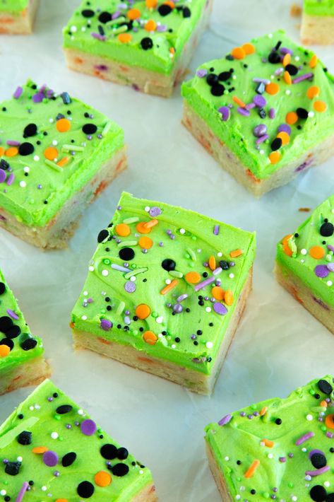 Halloween Sugar Cookie Bars Halloween Cookie Sandwiches, Halloween Cookie Bars Recipes, Frosted Sugar Cookie Bars, Slice And Bake Halloween Cookies, Sugar Cookie Recipe Halloween, Cake Mix Halloween Cookies, Halloween Cookie Bars, Halloween Blondies, Halloween Themed Cookies