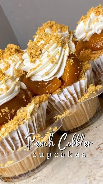 Dashawna Land|Treat Maker|Christ Follower on Instagram: "🤤How many delicious Peach Cobbler Cupcakes would you eat🍑 ⁉️If you love peach cobbler make sure you share this 😎 Peach cobbler flavored cake, loaded with graham cracker crust, caramelized peaches, cheesecake frosting, and graham cracker crumble for the topping. 🚚Available for local pickups in Saint Louis, Mo check my story for pricing. Recipe available for purchase on my website😉 ClSs available as well! #peachcobbler #cupcakes #cake # Peach Cobbler Cheesecake Cups, Peach Cobbler Cupcakes Yellow Cake Mixes, Peach Cobbler Cheesecake Cupcakes, Honey Peach Cream Cheese Cupcakes, Peach Cobbler Factory, Peach Cobbler Cupcakes, Caramelized Peaches, Cheesecake Frosting, Cookie Cups