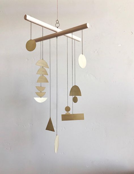 10 Modern Wind Chimes and Mobiles That Sway With Sophistication Modern Wind Chimes, Hanging Mobile Art, Modern Crib Mobile, Modern Crib, Done By Deer, Modern Mobile, Diy Wind Chimes, Mobile Art, Baby Crib Mobile