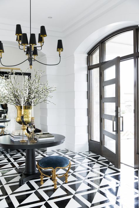 A sophisticated and elegant entryway can set the tone for the rest of a home, designed by Jessica Bennett. Bauhaus Office, Black And White Flooring, White Flooring, Millwork Details, Alice Lane, Elegant Entryway, Contemporary Tile, Coastal Contemporary, Interior Minimalista