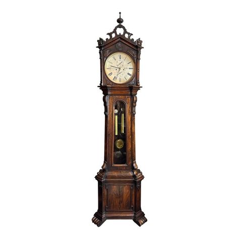 This listing is for a gorgeous antique Scottish grandfather/ long case clock.  This piece is by John and William Mitchell of Glasgow (Scotland) circa 1830s.  The case is quite unique as it was made in an ornate gothic revival style.  The clock has a glass windowed mid- section, silver plated dial, and bright brass hardware,  as typical for the Regency Period.  The case has ornate flowing carvings throughout and has a nice spire on top.   The movement is an 8 day time and strike with a visible se Grandfather Clock Aesthetic, Scottish Gothic, Grand Father Clock, Gothic Clock, Coocoo Clock, Victorian Clock, Ornate Window, William Mitchell, Grandmother Clock