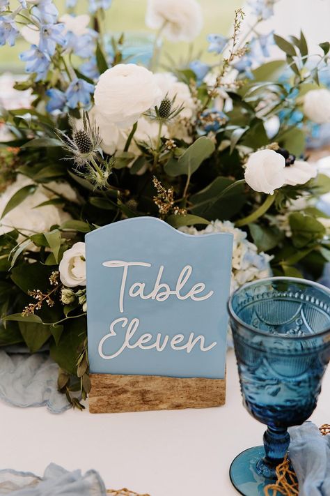 Faux Sea glass table numbers (made from acrylic plastic sheets)  are the perfect way to style your tables for your beach look!  PRODUCT DETAILS: -Blank sea glass are not available for sale. -Driftwood stands may be added on but not sold by themselves. -Sea glass is faux, it is NOT real sea glass, made from plastic acrylic. They are fully painted on the back and not transparent.  - Minimum of 5. Samples are not for sale. -This listing is for one sea glass table number.  -Engraved lettering will be in white. -Sea glass is approximately 5X7". -If you don't see a color or size you are looking for, please contact me for an additional fee. -These table numbers are cut and engraved on a laser machine and hand painted in waterproof ink.  -Driftwood is natural, picked from local beaches in Annapoli Glass Table Numbers, Sea Glass Table, Coastal Wedding Cake, Glass Wedding Decor, Coastal Wedding Decor, Sea Glass Wedding, Wedding Decor Table, Wedding Table Themes, Acrylic Table Numbers