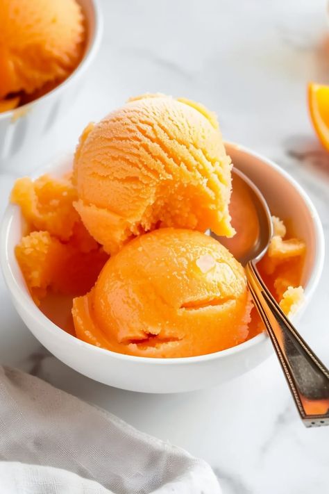 This easy orange sorbet is so tasty and refreshing! With just 4 ingredients, you'll have a homemade treat no one can resist. Ninja Creami Mango, Mango Sorbet Recipe, Pumpkin Ice Cream Recipe, Mango Frozen Yogurt, Healthy Frozen Yogurt, Ice Cream Vegan, Protein Dessert, Sorbet Is, Lassi Recipes