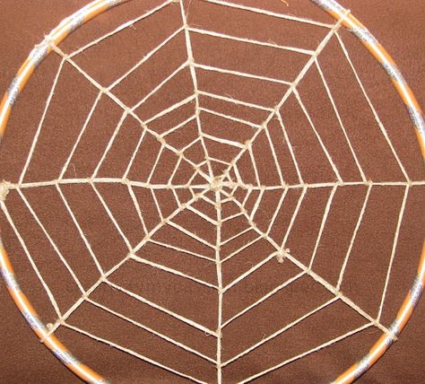 Hula Hoop Spider Web... love the scale!!! Hula Hoop Spider Web, Making A Spider Web With Yarn, Spiderweb Suncatcher Craft, Spider Web Yarn Craft, Spiderweb Dreamcatcher, Hula Hoop Rug, How To Make Spiders, Spider Web Craft, Halloween Craft Treats