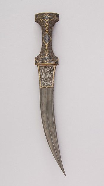 Persian Qajar period jambiya dagger. Medium:Steel, gold Dimensions:H. 15 3/8 in. (39.1 cm); H. of blade 10 1/2 in. (26.7 cm); W. 5/16 in. (0.8 cm); D. 1 3/16 in. (3 cm); Wt. 11.4 oz. (323.2 g), Met Museum. Ancient Persia, Pretty Knives, Ancient Persian, Dagger Tattoo, Dagger Knife, Metal Works, Metropolitan Museum Of Art, Metropolitan Museum, Museum Of Art