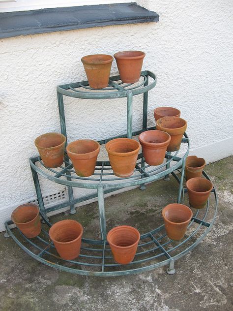 Pot Stands Outdoor Metal, Stands For Plants Pots, Plant Shelves Outdoor, Outdoor Metal Plant Stands, Roof Garden Design, Tattoo Plant, Iron Plant Stand, Small Balcony Garden, نباتات منزلية