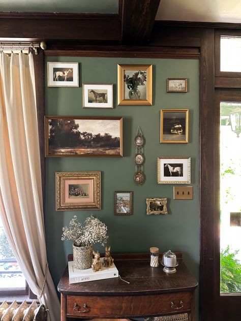 Green Wall Gallery Ideas, Photo Wall Interior Design, Green Wall With Gold Frames, Good Frame Gallery Wall, Gallery Wall With Photos, Green Wall Gold Frames, Dark Green Wall With Gold Frames, Earthy Gallery Wall, Gallery Wall On Wallpaper