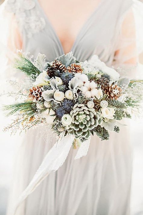 Pinecones and frosted greenery give instant wintery wedding vibes. Winter Bridal Bouquets, Wool Flowers, Rustic Winter Wedding, Winter Wedding Bouquet, Winter Bouquet, Winter Wedding Flowers, December Wedding, Winter Bride, Winter Wedding Inspiration