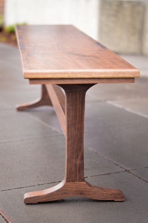 "The Porter Bench //  This solid walnut trestle bench is designed to match our Porter Dining table but will complement just about any entryway or dining room.  * 72\" long * 14\" wide * 19.5\" tall * Made of solid north American Black Walnut * Finished with OSMO wood wax, durable, waterproof, food and skin safe.  Most custom requests can be accommodated, please ask! Please note, this listing is for the bench only, the table listing can be found at this Etsy listing here: https://goo.gl/ux6WfD  M Diy Adirondack Chair Plans, Diy Adirondack Chair, Trestle Bench, Wood Bench Design, Adirondack Chair Plans, Solid Wood Benches, Custom Headboard, Entry Bench, Wood Wax