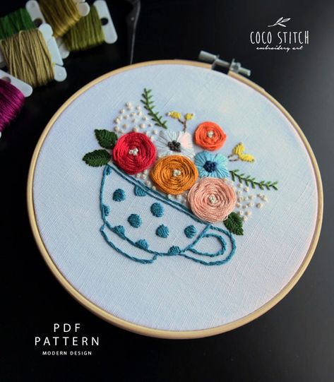 "FINISHED SIZE:    6\" Embroider Hoop    7\" Embroider Hoop This adorable tea cup illustrated embroidery is a beginner friendly pattern. You can enjoy this floral hand embroider project anytime anywhere! Fill your teacup with wonderful floral designs and leaves. Start this colourful and vibrant piece today! Designer's Review >> PDF file Includes: - 6\" Template - 7\" Template - DMC Color no. - Anchor Color no. - Embroidery Needle no. - Detail Floss no Illustration - Which Stitch to Use - How man Cup Embroidery, Hand Pattern, Hand Embroidery Videos, Diy Embroidery Patterns, Handmade Embroidery Designs, Hand Embroidery Projects, Embroidery Patterns Free, Hand Embroidery Pattern, 자수 디자인