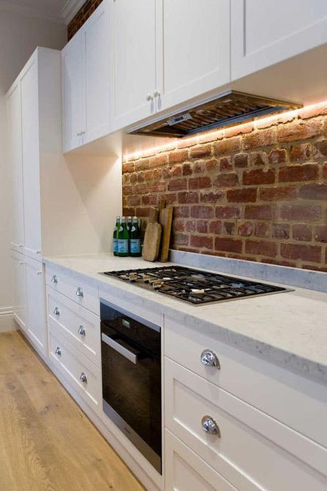 24 Stylish Brick Backsplash to Transform any Kitchen Brick Slip Kitchen Wall, Exposed Brick Tiles, White Kitchen Exposed Brick, Brick Slip Wall Kitchen, Brick Black Splash Kitchen, Brick Slip Kitchen Splashback, Kitchen Design Brick Wall, Brick Slip Splashback, Brick Tile Splashback Kitchen