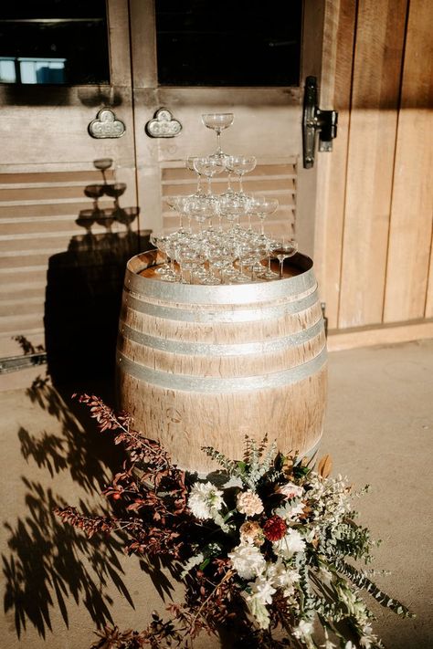 A stunning champagne tower awaits Jacqueline and Warick at their Yabbaloumba Retreat wedding reception. Set atop a rustic barrel, the glasses are ready for a cascade of champagne, with a beautiful floral arrangement adding a touch of rustic elegance to the scene. This picturesque setup captures the essence of a romantic, rustic country wedding. Plan your unforgettable wedding reception at Yabbaloumba Retreat and create memories that will last a lifetime. Country Glam Wedding, Wine Barrel Wedding, Rustic Glam Wedding, Dream Wedding Reception, Elegant Wedding Reception, Champagne Tower, Exquisite Decor, Wedding Display, Rustic Centerpieces