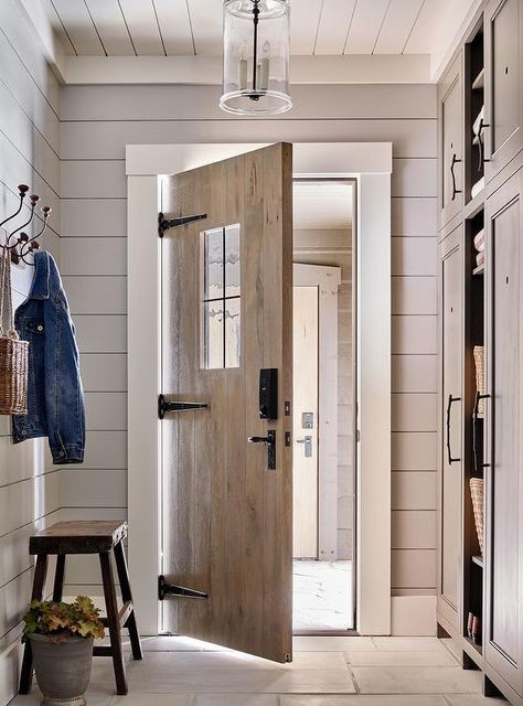 Country style mudroom boasting gray shiplap walls painted in Pratt & Lambert Chalk Gray with white shiplap ceiling trim and a seeded glass pendant light for a farmhouse finish. Mudroom With Shiplap, Shiplap Mudroom, Gray Shiplap, Country Laundry Rooms, Rustic Entry, Bluestone Pavers, Shiplap Ceiling, Ceiling Trim, Shiplap Walls