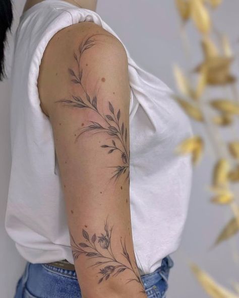 Poppy Arm Wrap Tattoo, Leafy Half Sleeve Tattoo, Airy Tattoos For Women, Dainty Floral Arm Wrap Tattoo, Shoulder Vine Tattoo Stencil, Flower Tattoos Around Arm, Greenery Shoulder Tattoo, Black And Grey Vine Tattoo, Coverup Tattoo Ideas Ribs