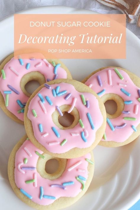 How much do you love perfectly decorated cookies? Cookie decorating is so much fun especially when you start with an easy tutorial like this. There’s no need to overcomplicate it when you can make something that’s so cute, fun and colorful! This Decorated Donut Cookie is beginner friendly and perfect for anyone regardless of your [...] The post Donut Sugar Cookie Decorating Tutorial first appeared on Pop Shop America. Donuts Cookies Decorated, Doughnut Cookies Decorated, Beginner Cookie Decorating Designs, Easy Round Cookie Decorating Ideas, Donut Decorated Cookies, Decorated Baked Goods, Fun Sugar Cookies Decorated, Two Sweet Cookies Decorated, Cookie Designs Ideas Simple