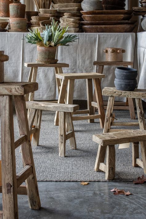 Enhance your space with a hint of rustic elegance through these reclaimed elm wood stools. Each piece showcases the allure of texture and a warm patina. Distinctive in design, every stool varies in size, grain color, and may exhibit natural wood cracks. Due to their delicate nature, we do not recommend using them for sitting. Raw Wood Projects, Stool Decoration Ideas, Homemade Wood Gifts, Rustic Boutique Ideas, Small Wood Furniture, Flint Cottage, Wooden Stools Diy, Wabi Sabi Furniture, Rustic Entryway Table