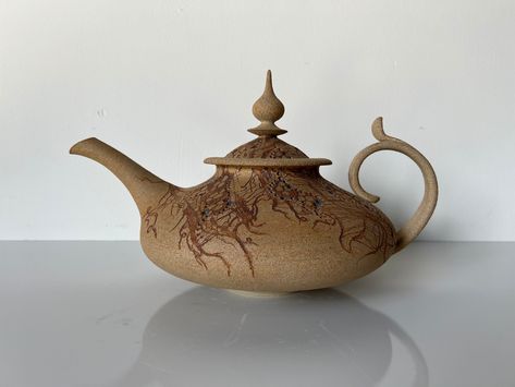 "A beautiful vintage organic sculptural studio pottery teapot. Features organic earthy matte glaze finish with hand painted detailing around the top. Great attention to detail along the side handle and beautiful sculptural lid . Signed on the base. C,1995 Measures: 16.0\" w x 10.0\" d x 9.5\" h / Inches In great vintage condition with a very small chip on top. Please see all photos for additional details. Look at the pictures carefully , they are a part of the description . All my items are vintage and keep in mind vintage items are not New . Items had a life before ! I am trying to show defects , but if you have any questions , please contact me." Ceramic Teapots Handbuilt, Teapot Handles, Teapot Pottery, Pottery Tea Pots, Tea Pots Art, Pottery Houses, Ceramic Art Sculpture, Vintage Teapot, Handmade Teapot