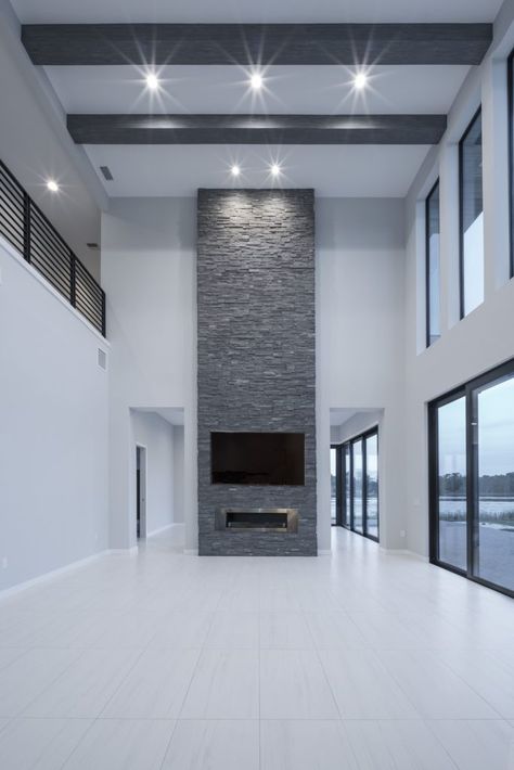 Inside Of Modern Homes, High Ceiling Fireplace Wall Stone, Tv Wall Design Tall Ceiling, Stone Fireplace Floor To Ceiling Modern, Modern Floor To Ceiling Fireplace, Floor To Ceiling Fireplaces, Small High Ceiling Living Room Modern, Tall Ceiling Fireplace Ideas, High Ceiling Tv Wall Ideas