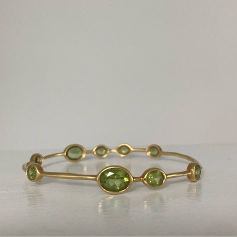 Excellent / Brand New Condition 100% Authentic Retail Price $3,495 *Will Include The Ippolita Leather Zip Pouch Pictured* Ippolita 6.85ctw Green Peridot Rock Candy 9 Station Bangle Bracelet From The Rock Candy Collection 18k Yellow Gold Featuring 6.85 Carat Mixed Cut And Oval Peridot Metal Type: 18k Yellow Gold Marks: 18k, Designer Signature Signature: Ippolita Total Item Weight (G): 13.9 Gemstone: Peridot Carat Weight: 6.85 Stone Count: 9 Stone Dimensions (Mm): Stone Shape: Mixed Cut, Oval Ston Ippolita Bangles, Ippolita Jewelry, Leather Zip Pouch, Candy Collection, Rock Candy, Green Peridot, Oval Stone, Zip Pouch, Gold Bangles