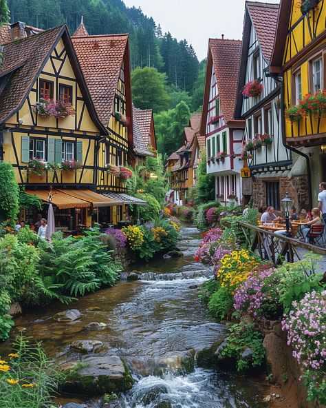 Half-timbered houses & vibrant flowers in a German town. Explore historic landmarks in Germany. #GermanyLandmarks #HistoricGermany #TravelGermany #VisitGermany German Architecture Aesthetic, Germany Places To Visit, Living In Germany Aesthetic, Old German Houses, Germany Buildings, Germany Houses, Germany Honeymoon, Germany Village, German Buildings