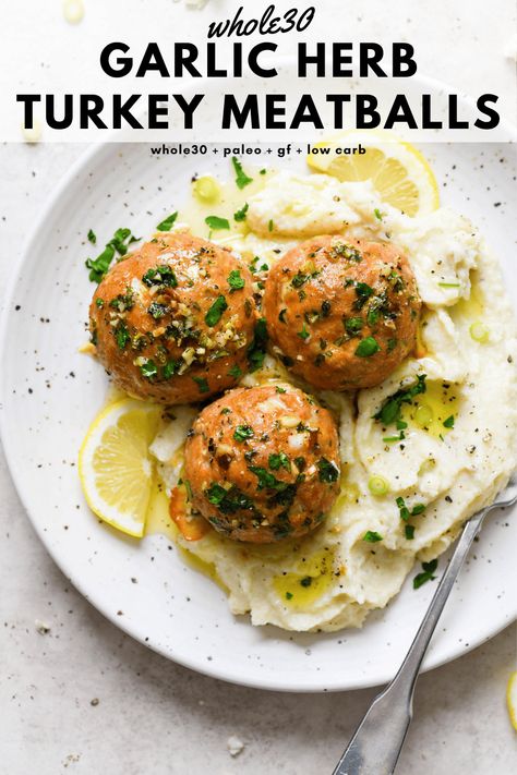 These baked whole30 garlic herb turkey meatballs are a tasty protein rich main dish that are made with ground turkey, fresh herbs, garlic, lemon, and ghee. Perfectly balanced, cooked to perfection, and made without cheese or breadcrumbs. Whole30, paleo, gluten free, low carb + keto friendly. #whole30recipes #turkeymeatballs #glutenfreedairyfree #lowcarb #ketofriendly Whole 30 Turkey, Whole30 Turkey Meatballs, Garlic Herb Turkey, Paleo Turkey Meatballs, Gluten Free Turkey Meatballs, Turkey Meatballs Healthy, Paleo Turkey, Ground Turkey Meatballs, Gluten Free Turkey