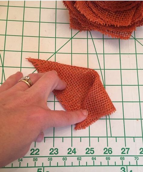 Fold orange burlap squares to make this burlap pumpkin wreath Bandana Wreath, Burlap Pumpkin Wreath, Pumpkin Wreath Diy, Easy Fall Wreaths, Burlap Pumpkins, Shaytards, Mickey Mouse Pumpkin, Straw Wreath, Burlap Flower