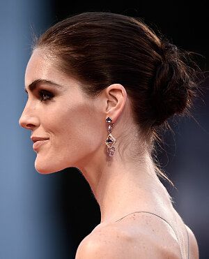 Easy on the Eyes - Hilary Rhoda list Best Hair Stylist, Hilary Rhoda, Gemstone Earrings Dangle, Twist Bun, Venice Film Festival, Cosmopolitan, Film Festival, Gemstone Earrings, Venice