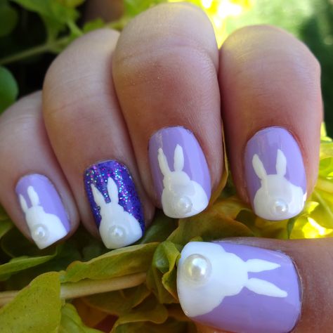 Easter Bunny Butt Nails. Used Sally Hansen Xtreme Wear "Lacey Lilac," Wet n Wild "On a Trip," and Sinful Colors "Frenzy" for purples. Painted bunnies with nail art brush and added pearl detail for tail. #nailart Sparkly Funny Bunny Nails, Bunny Ear Nail Design, Easy Bunny Nail Art, Purple Bunny Nails, Rabbit Manicure, Painted Bunnies, Sally Hansen Xtreme Wear, Animal Nail Art, Art Brush