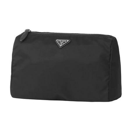 This cosmetic bag from Prada is crafted with a black nylon. The durable and easy to clean material adds functionality to the pouch. Its zipper fastening opens to a spacious interior with a zipper pocket. This toiletry case is perfect for travel or everyday use! Size: L. Prada Triangle, Prada Nylon, Triangle Logo, Cleaning Materials, Makeup Bags Travel, Cosmetic Pouch, Makeup Case, Black Nylon, The Pouch