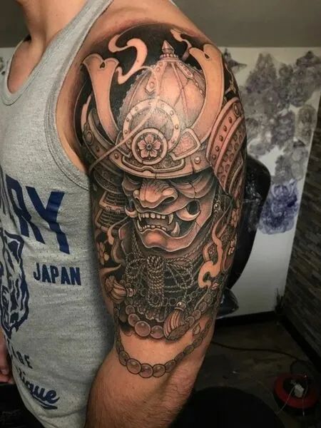 Japanese Armor Tattoos Samurai Shoulder Tattoo, Tato Phoenix, Samurai Mask Tattoo, Hanya Tattoo, Cool Shoulder Tattoos, Samurai Mask, Small Shoulder Tattoos, Samurai Tattoo Design, Armor Tattoo