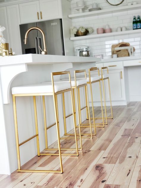 #whitelanedecor @whitelanedecor #ad Fuji Gold metal barstools, white kitchen, rectangle subway tile, open shelves in kitchen, White And Gold Counter Stools, Modern Barstools In Kitchen, Pink Barstools, Kitchen Stools For Island, Barstools In Kitchen, Gold Barstools, White Barstools, Bar Stools Metal, Kitchenaid Appliances