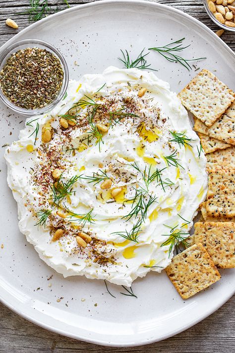 Labneh is a soft, Middle Eastern strained yogurt cheese, which makes for a delicious dip when topped with olive oil, spices and herbs! | thecozyapron.com #labneh #labnehrecipe #labnehdip #labnehrecipehowtomake #labnehrecipehomemade Labneh Dip, Labneh Recipe, Appetizer Easy, Yogurt Cheese, Unique Appetizers, Side Orders, Eastern Cuisine, Lebanese Recipes, Yummy Dips