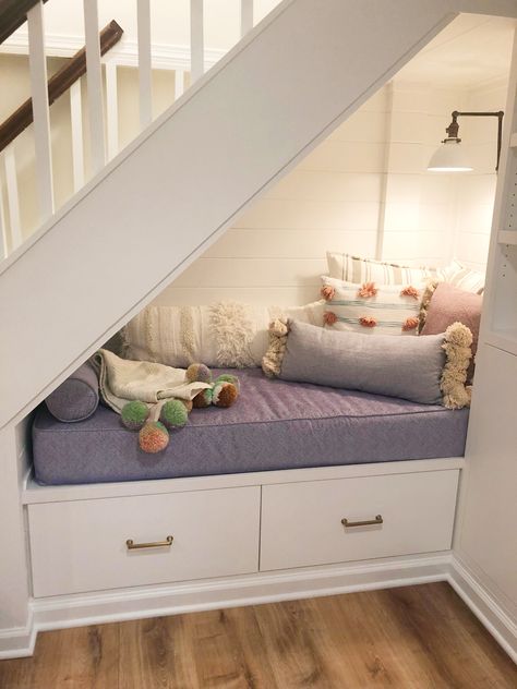 Built in seating under the stairs — the ultimate reading Nook!   Designed by Ali Wente @awente1  Built by Ian Horowitz Manta Property Services Farmhouse Light by newwineoldbottles Etsy Custom cushion by cushionsource.com Custom cushion by cushionsource.com Build A Reading Nook, Nook Under The Stairs, Bed Under Stairs, Under Stairs Dog House, Under Stairs Nook, Stair Nook, Room Under Stairs, Space Under Stairs, تحت الدرج