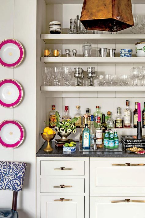 The Built-In Bar: Give It an Accent - 13 Achievable Ideas Inspired by a 1926 Tudor - Southernliving. The three pink-rimmed plates on the wall belonged to a previous owner of the house. Barrie accented them with matching pink candles from Blackhawk Hardware in Charlotte. Slate Interior, Bandeja Bar, Butler’s Pantry, Built In Bar, North Carolina Homes, Wet Bar, Southern Living, Mini Bar, Breakfast Room