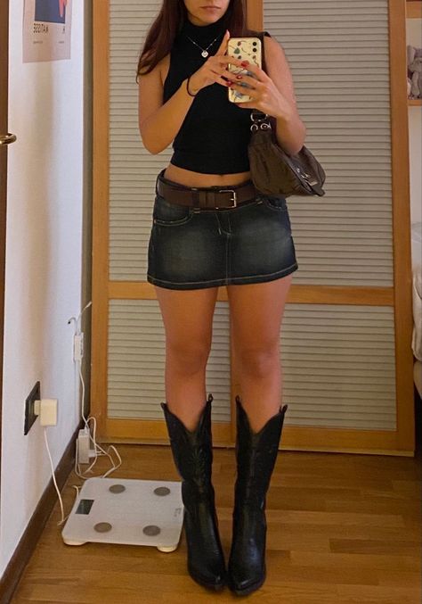 Mini Skirt Outfit Jean, Denim Mini Skirt Aesthetic, Outfits With Mini Denim Skirt, Mini Skirt And Cowboy Boots Outfit, Denim Skirt Going Out Outfit, Jeans Into Mini Skirt, Dark Denim Mini Skirt Outfit, Denim Mini Skirt Outfit Ideas, Jean Miniskirt Outfits