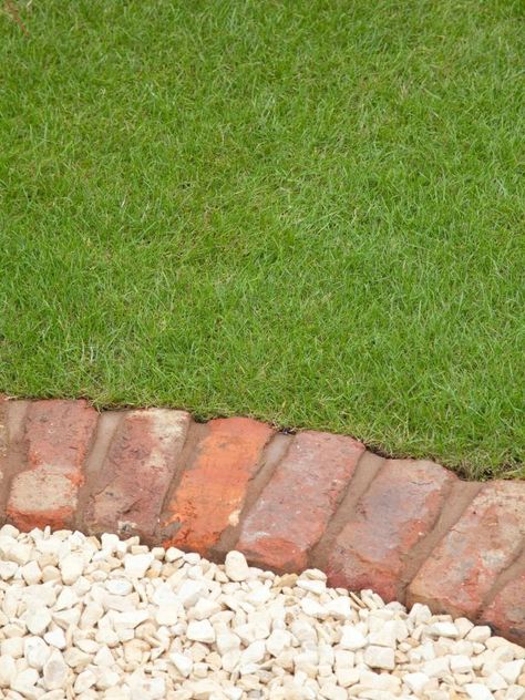 Ideas for Lawn Edging | HGTV Mowing Strip Lawn Edging, Landscaping With Gravel, Lawn Borders Edging, Landscape Edging Ideas, Mowing Strip, Plastic Lawn Edging, Lawn Borders, Diy Lawn, Aerate Lawn