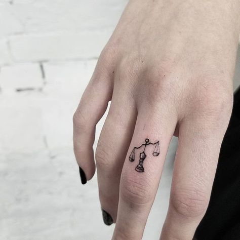 Tiny libra scale tattoo done by @release852 @inkandwatertattoo..If you are looking for one of a kind art, don't be shy, DM us to schedule an appointment or consulatation   Tag your friends help me grow ☘ #release852 #torontotattoo #torontotattooartist #ta Libra Scale Tattoo, Tattoo Main, Justice Tattoo, Petit Tattoo, Libra Tattoo, Scale Tattoo, Tattoos Geometric, Zodiac Tattoos, Constellation Tattoos