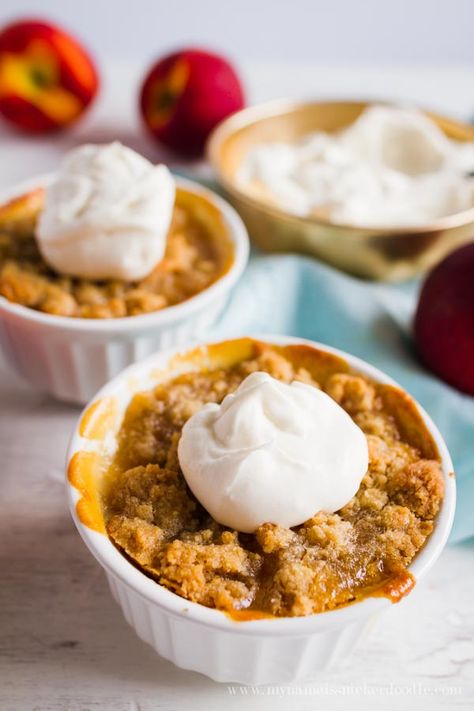 Mini Peach Crisps are super easy to make and taste fantastic!  Especially with a scoop of ice cream!  |  mynameissnickerdoodle.com Mug Peach Crisp, Peach Crisp For 2, Peach Crisp In A Mug, Individual Peach Crumble, Peach Crumble For Two, Peach Desserts For Two, Small Ramekin Desserts, Peach Desserts For One, Peach Crisp Small Batch